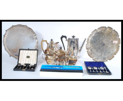 A collection of silver plated items to include salver trays, coffee pot, tea service, presentation cake knife and boxes tea s