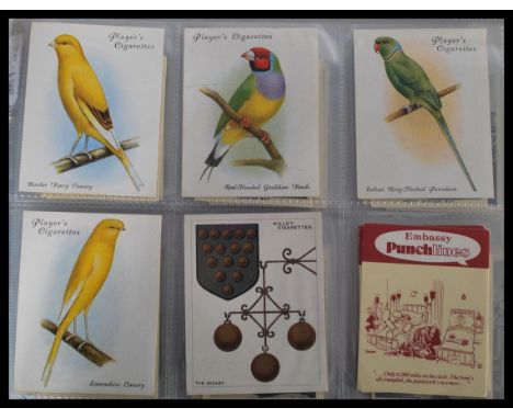 A group of four vintage 20th century cigarette albums to include Sarony ships of all ages , Churchmans , Treasure Trove , Int