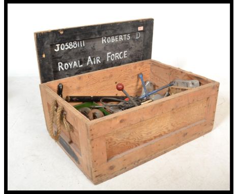 A vintage ebonised military shipping crate, with notation to the front to include vintage electrical tools to the inside.