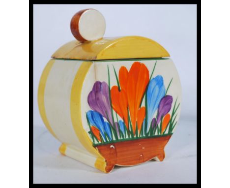 An early 20th century Clarice Cliff Bizarre Bonjour shape lidded condiment pot hand painted in the Crocus pattern with Newpor