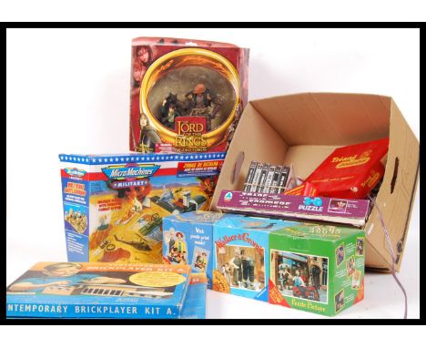 A box of assorted various vintage toys and games to include a boxed Micro Machines Military playset , Lord Of The Rings boxed