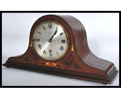 An early 20th Century Edwardian Hamburg America Company HAC inlaid mantle clock set within a mahogany case with a fitted eigh