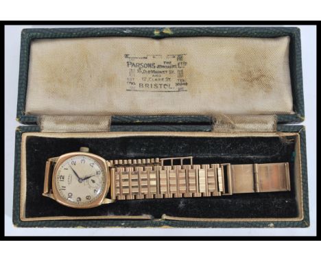 A vintage Gents 9ct gold Rotary wristwatch set to a 9ct gold hallmarked bracelet strap. The Rotary Standard face with sub dia