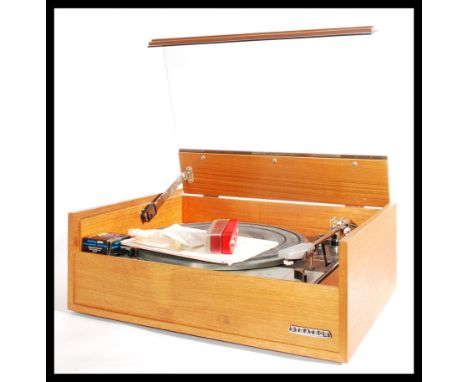 A vintage Goldring Leno GL75 record player, finishing in oreginal teak 'Dynatron'case / cabinet. Original documentation.