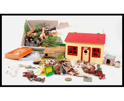 A collection of assorted original vintage Britains and other farm and zoo toys to include a buildings and accessories.  