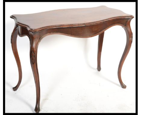 A 19th century walnut&nbsp;biedemeier console table. Of continental origin raised on serpentine legs having a bombe shaped fr