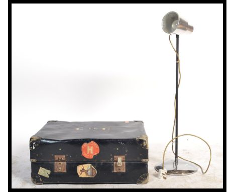 A mid century retro Italian anglepoise light with conical shade together with a vintage steamer trunk still with applied ship