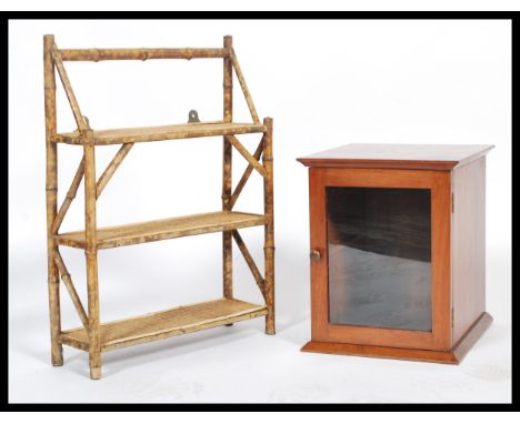 A Victorian mahogany smokers cabinet of box form with full length door to front together with an aesthetic movement bamboo wa