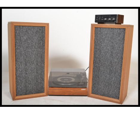 A retro 1970's teak cased and acryllic hood record player having inset Garrard deck being complete with the 2 speakers