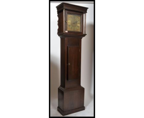 A 19th century longcase clock having oak trunk and hood with a brass face being unsigned. No movement weights or pendulum jus