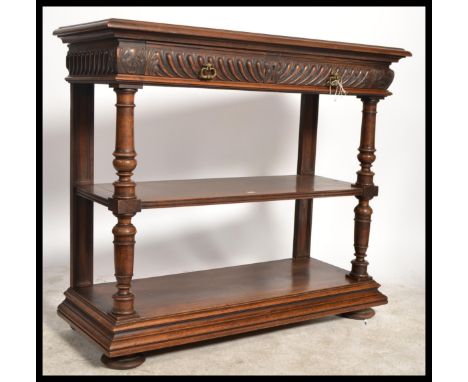 A 19th century French oak buffet / desert sideboard with an inset hinged marble top raised over drawers drawers and pan rack 