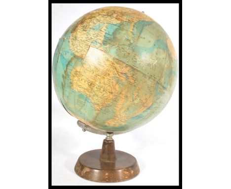 A vintage mid century Philips desk top terrestrial globe raised on a circular wooden base. Makers name present and dated for 