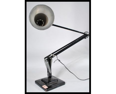 A 1940's Industrial pre-war Herbert Terry anglepoise lamp, raised on a cast metal two step base with pendant shade, finished 