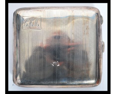 An early 20th century silver hallmarked cigarette case by William Hair Haseler; W H Haseler Ltd bearing hallmarks for&nbsp; B