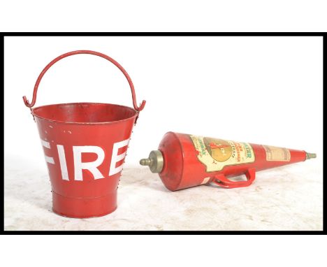 A vintage retro 20th century red painted metal fire bucket along with a mid century fire extinguisher perfect for lamp base c