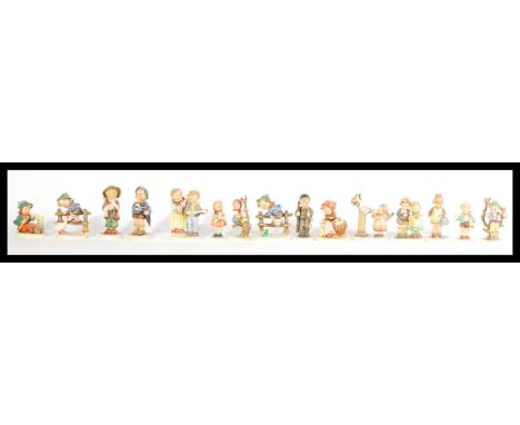 A good collection of 20th century German Hummel figurines to include many examples of small boys and girls. Each stamped to b