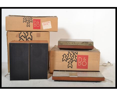 A stunning three piece music stereo system by Bang and Olufsen / B &amp; O, all packed in original boxes to include record pl