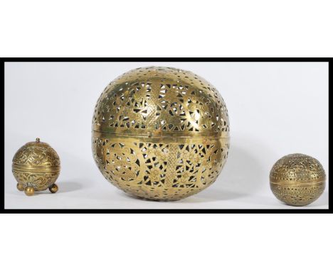 A group of three 19th century Indian / Persian Islamic brass items to include a pierced incense globe , a smaller example and