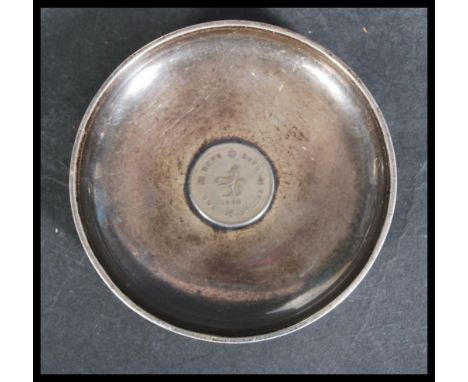 An early 20th century Chinese silver bowl pin dish with inset Hong Kong colonial coin. Chinese hallmarks present.