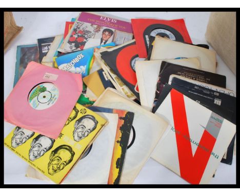 A large collection of 7" vinyl record singles and EP ( Extended Play ) dating from the 1960's featuring several artists and g