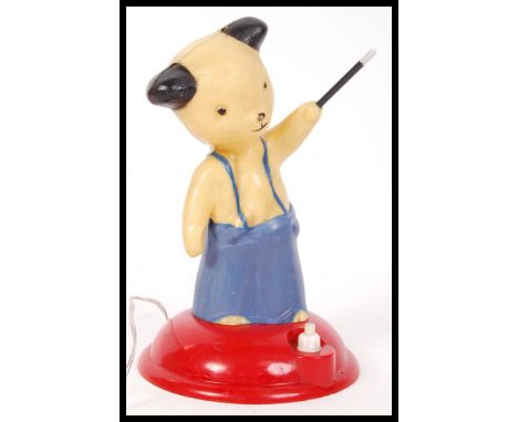 A rare ' Sooty ' night light / children's bedside table lamp in plastic raised on a red terraced base with switch.