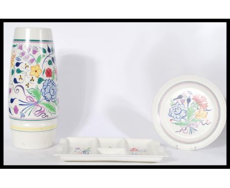 A large 20th century Poole Pottery vase together with a similar plate and a matching&nbsp;hors d'oeuvres dish. All stamped to