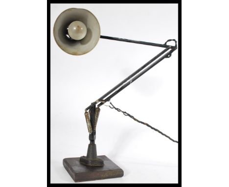 A vintage retro 20th century Herbert Terry wall mounted anglepoise desk workshop industrial lamp mounted on a later square eb