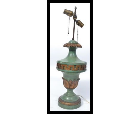 An early 20th century coaching lamp having verdigris coloured ceramic body with gilt embeliished acanthus leaf decoration wit