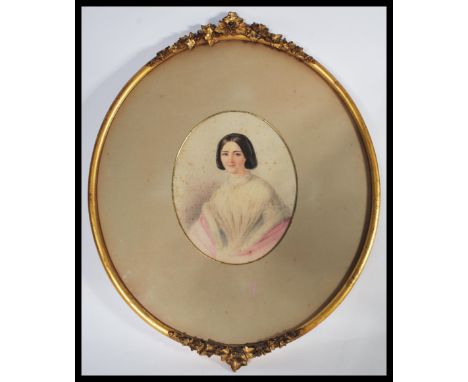 A 19th century Victorian watercolour portrait study / painting of a young lady being set within an oval frame and glazed. Uns