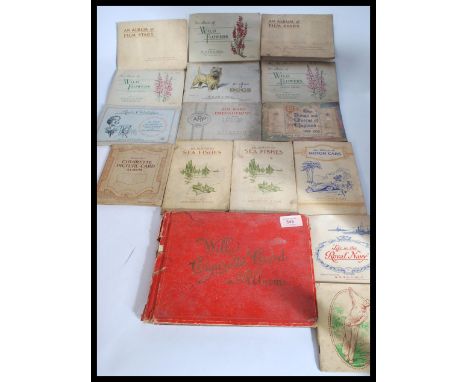 A collection of vintage cigarette cards albums including United Tobacco , South Africa , Players , Wills Etc. Please see imag