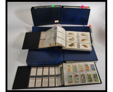 A LARGE collection of assorted vintage cigarette and trade cards. Spanning 8x albums, all neatly placed in display sleeves. T