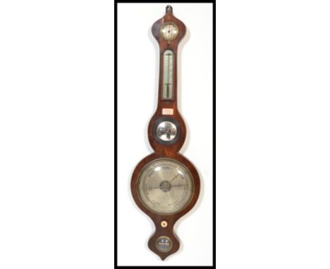 A 19th century mahogany wall mounted banjo barometer with central convex mirror over silvered dial with thermometer to the ne