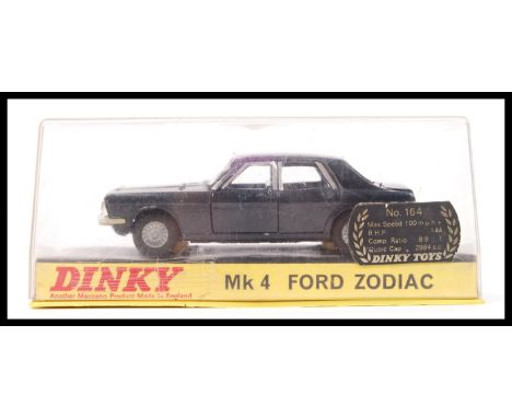 A vintage Dinky Toys diecast model no.164 ' Mk 4 Ford Zodiac ' in a black colourway with jewelled headlights. Appears to be i