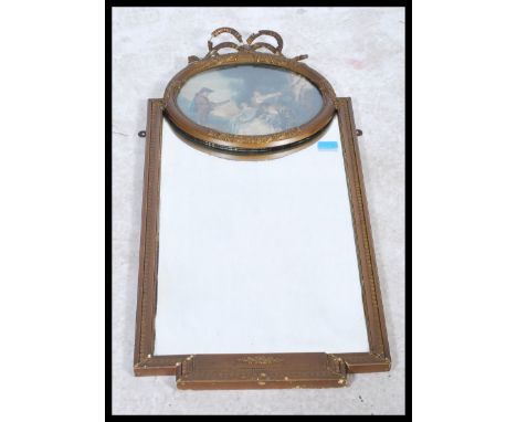 A decorative mid 20th century gilt mirror with swag decoration over print painting of musician and maidens having a mirror be