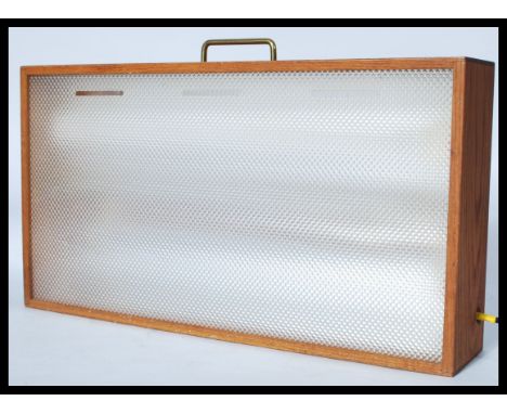 A retro 20th Century teak cased light box, hanging points / carry handle to the top with on and off switch. Measures 34 cm hi