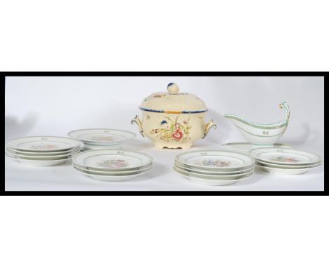 An early 20th century French ceramic hand painted part service consisting of a tazza , 14 plates and a sauce boat. Also a Fre