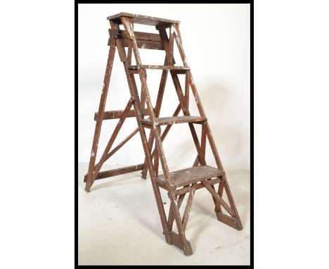 An early 20th century wooden trellis - lattice worked Industrial step ladder. Ideal as conversion to bookcase / display shelf