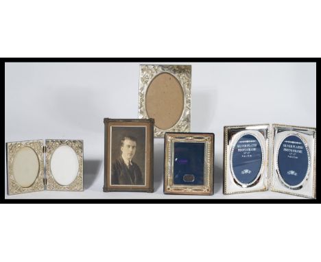 A collection of silver plated easel picture frames together with a silver sterling hallmarked picture frame.