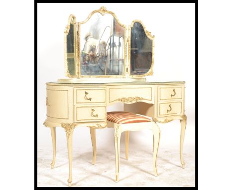 A 19th century style Louis style mirror back dressing table having a triptych mirror raised above a moulded kidney shaped des