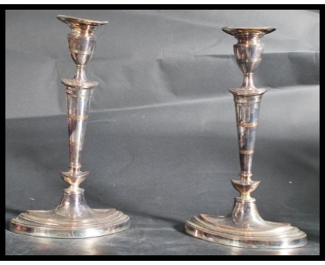 A pair of 20th century vintage silver plated candlesticks