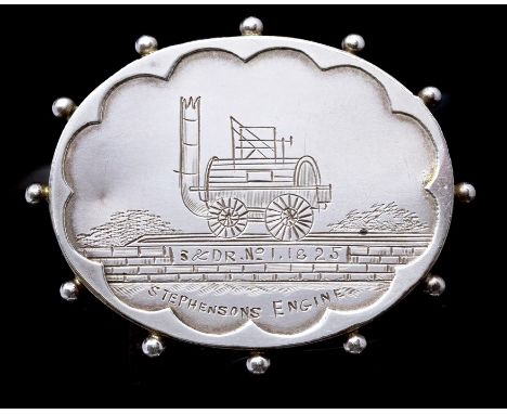 Railwayana Interest: A silver hallmarked, oval brooch, engraved with Stephenson's Engine, 'S &amp; D R No. 1 18 25', hallmark