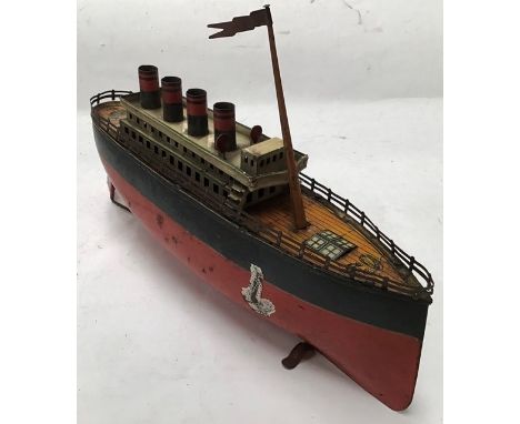 Tinplate: A vintage, tinplate Ocean Liner made by Arnold (Germany), 1920-30. Clockwork motor (not working), four funnels. 29c