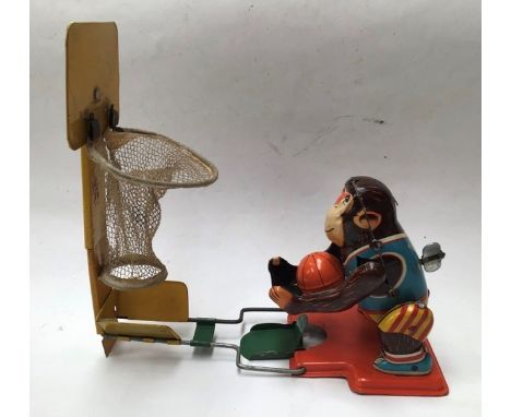 Tinplate: A 1960's Japanese clockwork tinplate basketball monkey made in Japan by TPS (Tokyo Playthings) working, a Marx tinp