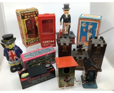 Money Boxes: A collection of vintage money boxes including: Yone Japan tinplate clockwork Coffin Bank, working, boxed, Marx C