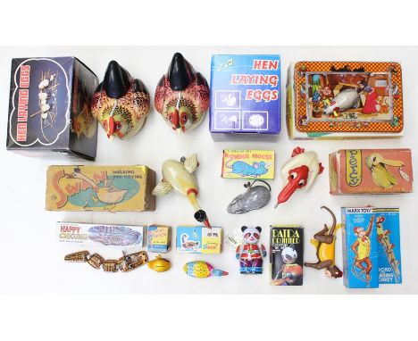 Tinplate: A collection of assorted boxed tinplate items to comprise: Marx Jocko the Climbing Monkey; Mechanical Percy Pelican