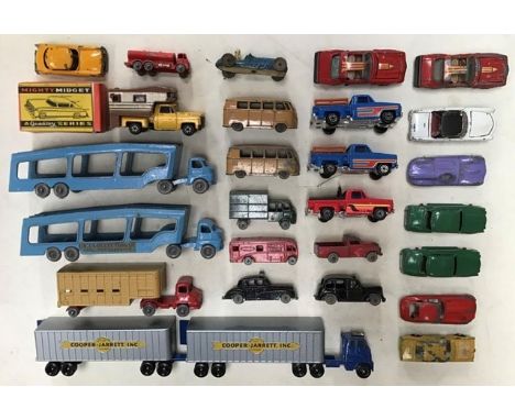 Diecast: A collection of assorted diecast vehicles to include Mini Dinky Cars, Matchbox Horsebox, transporters and Cooper Jar