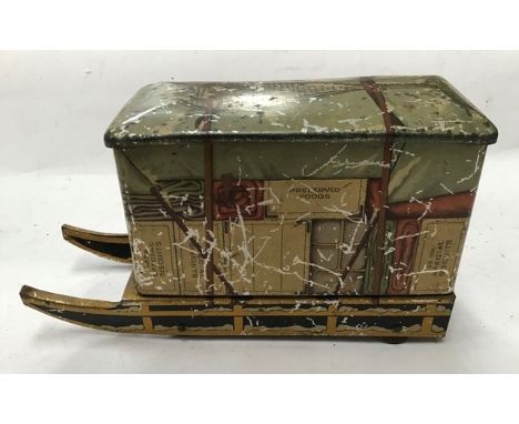 Tinplate: A vintage tinplate Jacobs Biscuit Tin, novelty tin in the shape of a Sleigh or Snow Sled. 7” long, 4” high. Hinged 