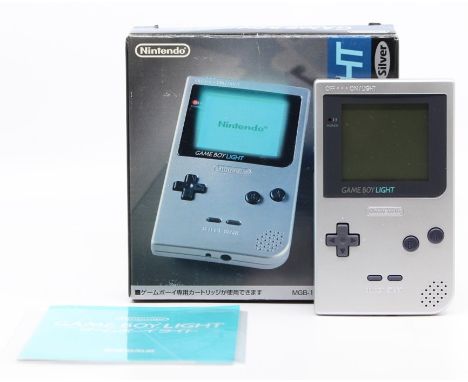 Gameboy: A boxed, Game Boy Light, Silver, original box, with instruction booklet, box having wear and creasing to corners and