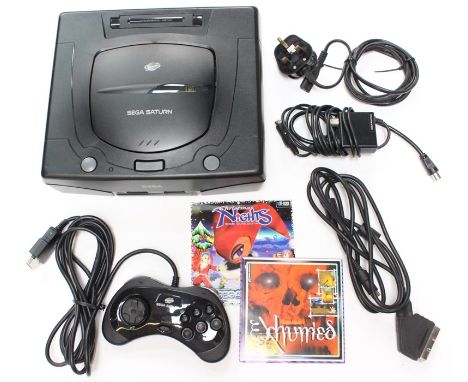 Sega: A boxed Sega Saturn console, complete with instructions, one controller, Scart and AV Lead, appears in very good condit