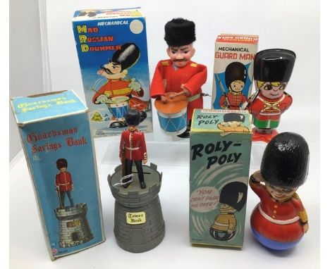 Tinplate: A collection of tinplate and plastic Guards including Marx clockwork Mad Russian Drummer, S.Y. Japan Mechanical Gua